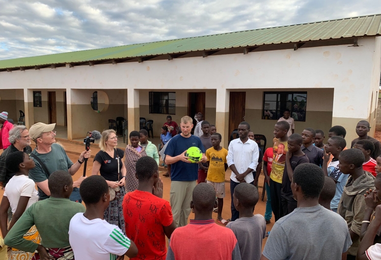 Matt gifting soccer ball