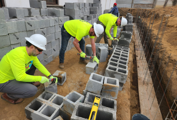 Mission Team Using Cutting Block