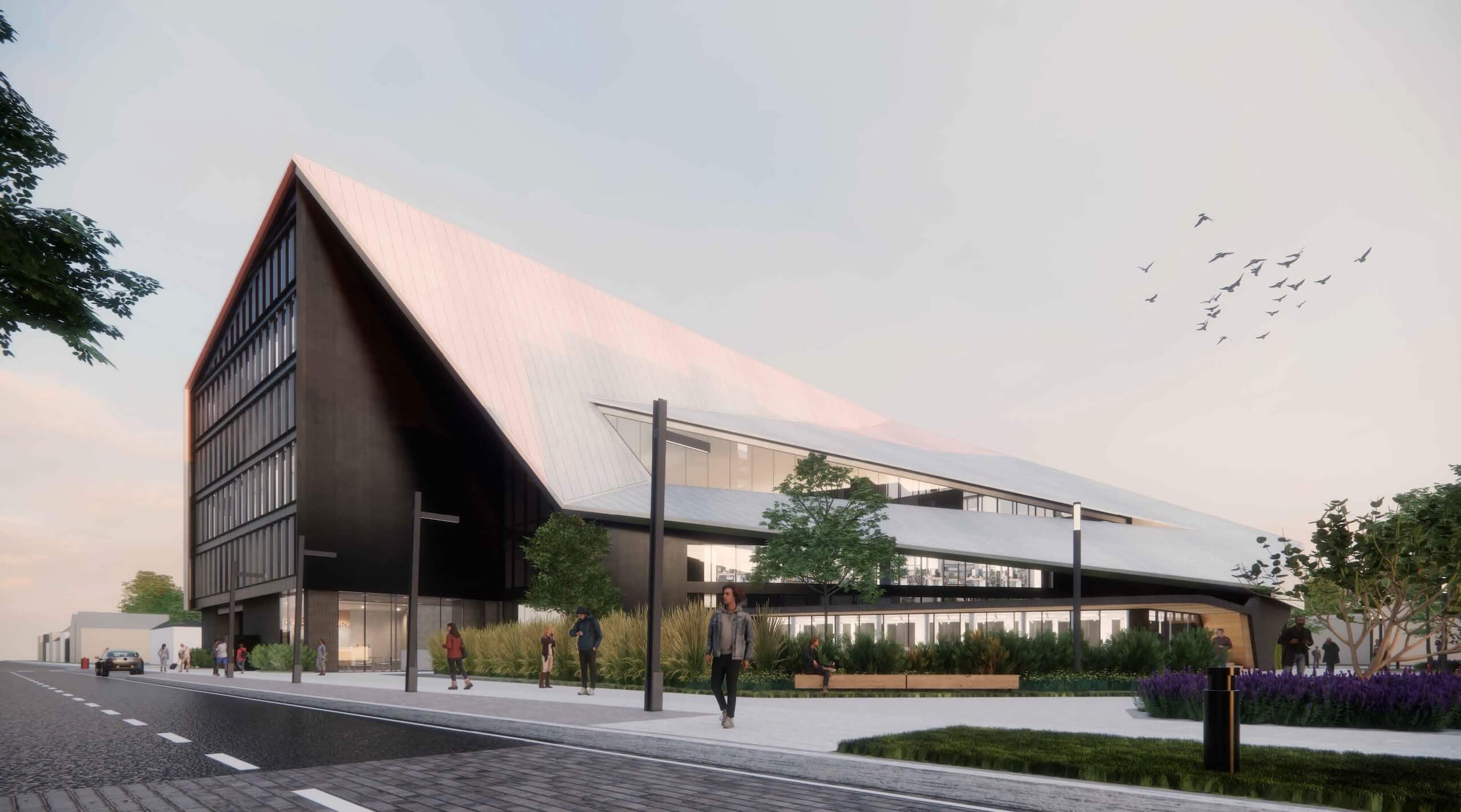Modern building with a sharp, sloped roof, large windows, and open spaces. People walk nearby, with trees, plants, benches, and birds flying in the sky.